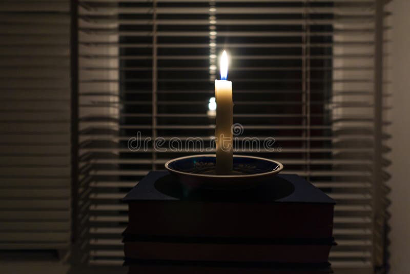 Candles in a dark room. Burning candles on the table and sockets on the  background. No electricity in the house. Blackout in the city. Power outage,  energy crisis concept 28623602 Stock Video