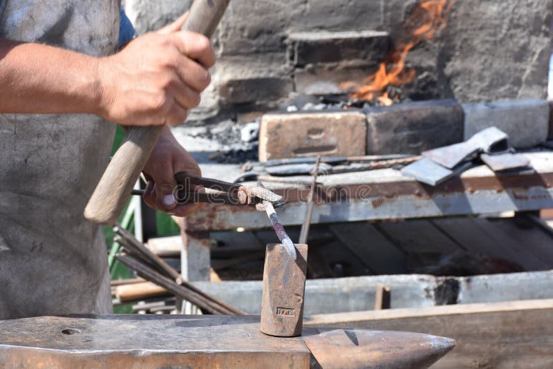 Blacksmith Beating Iron in Old Fashion Stock Photo Image of steel