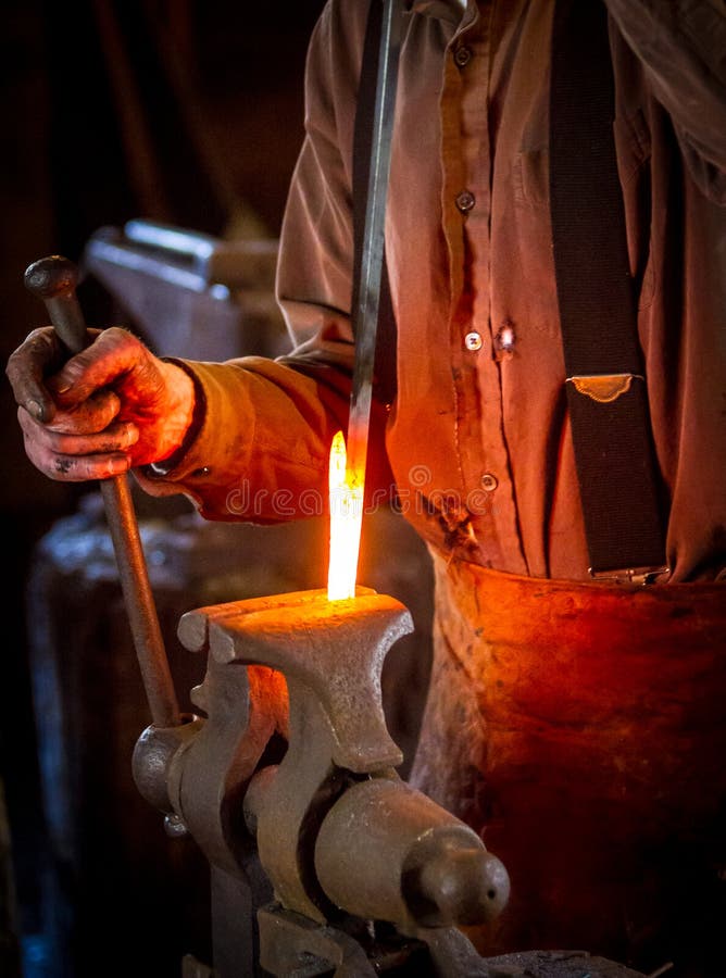Blacksmith Bending a Hot Metal Rod Stock Photo Image of shop, iron