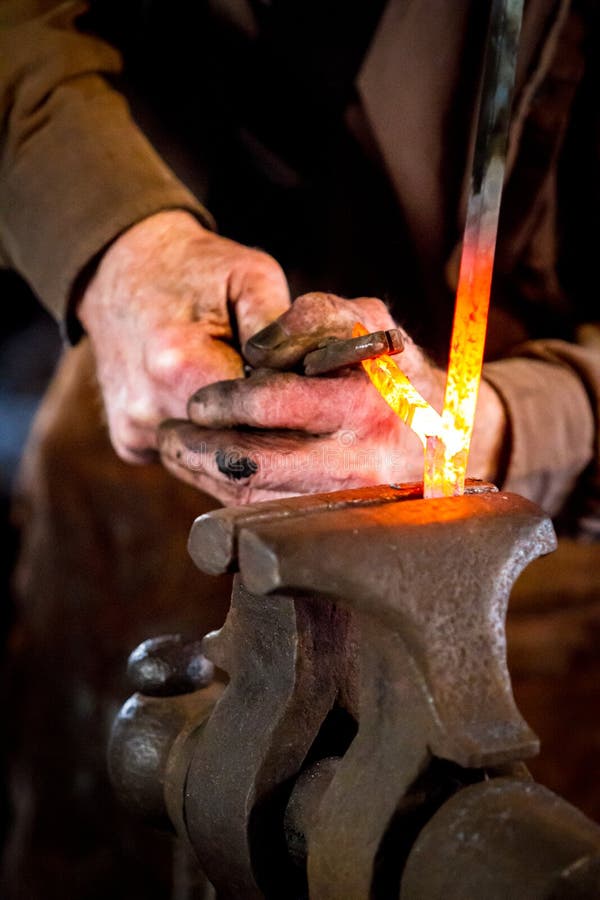 Blacksmith Bending a Hot Metal Rod Stock Photo Image of natural