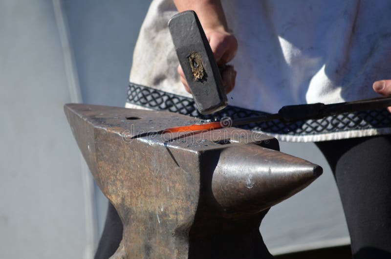 Blacksmith Hammers Red Hot Iron on an Anvil Stock Image Image of