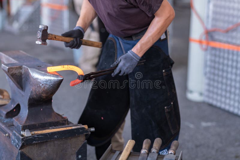 Blacksmith Making Horseshoe in the Stock Photo Image of