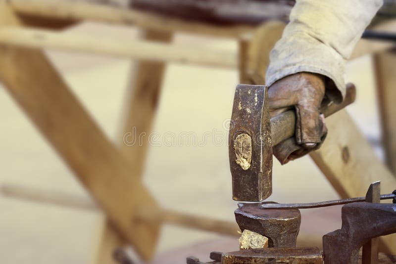Blacksmith at Work, Hammer in Hand Hitting the Anvil Stock Image Image of beat, production