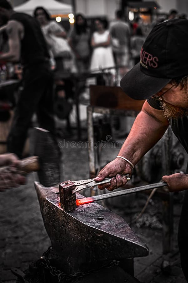 Blacksmith at work hitting the red iron stock images Blacksmith at work hitting the red iron stock images
