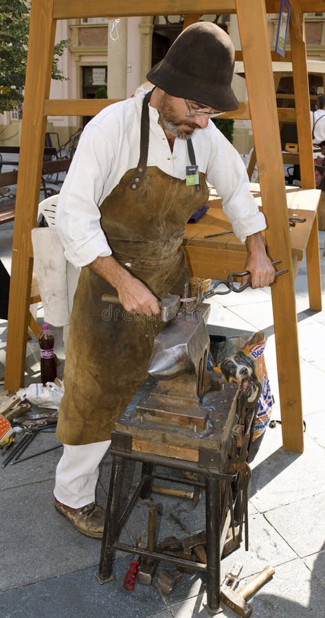 The blacksmith workshop during Festival Craftsmen Days ULUV in summer 2013 in Bratislava, Slovakia. Festival as a part of The Summer of Culture festival Bratislava, Slovakia, was held from August 31 to September 1, 2013, in the pedestrian zone of the Capital. There are over 100 craftsmen expected to attend and perform their skills in crafts. The blacksmith workshop during Festival Craftsmen Days ULUV in summer 2013 in Bratislava, Slovakia. Festival as a part of The Summer of Culture festival Bratislava, Slovakia, was held from August 31 to September 1, 2013, in the pedestrian zone of the Capital. There are over 100 craftsmen expected to attend and perform their skills in crafts.