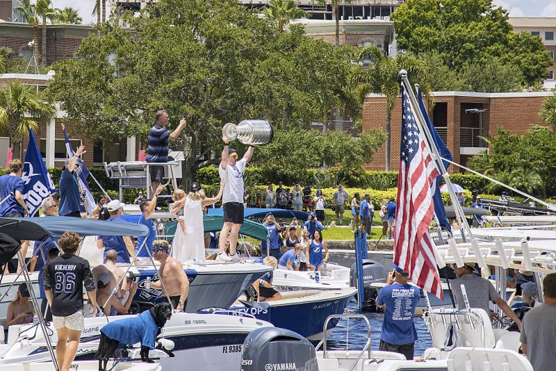 Blake Coleman of the Tampa Bay Lightning raising the Stanley Cup amongs a crowd of boats at the 2021 Stanley Cup boat parade. Blake Coleman of the Tampa Bay Lightning raising the Stanley Cup amongs a crowd of boats at the 2021 Stanley Cup boat parade