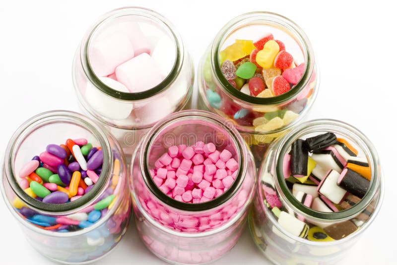 Glass bottles filled with assorted sweets including liquorice and sugar coated jellies. Glass bottles filled with assorted sweets including liquorice and sugar coated jellies