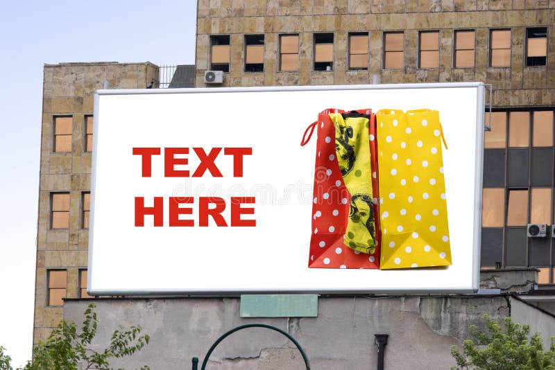 Blank billboard in city with shopping bag