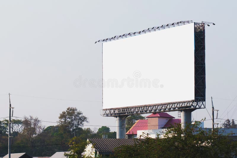 Blank billboards in city with blue sky