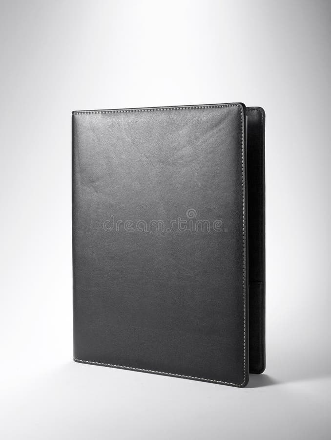 Office Supplies,Black leather notebook royalty free stock photos