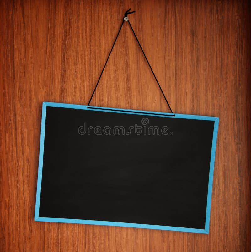 Blank blackboard on wooden wall