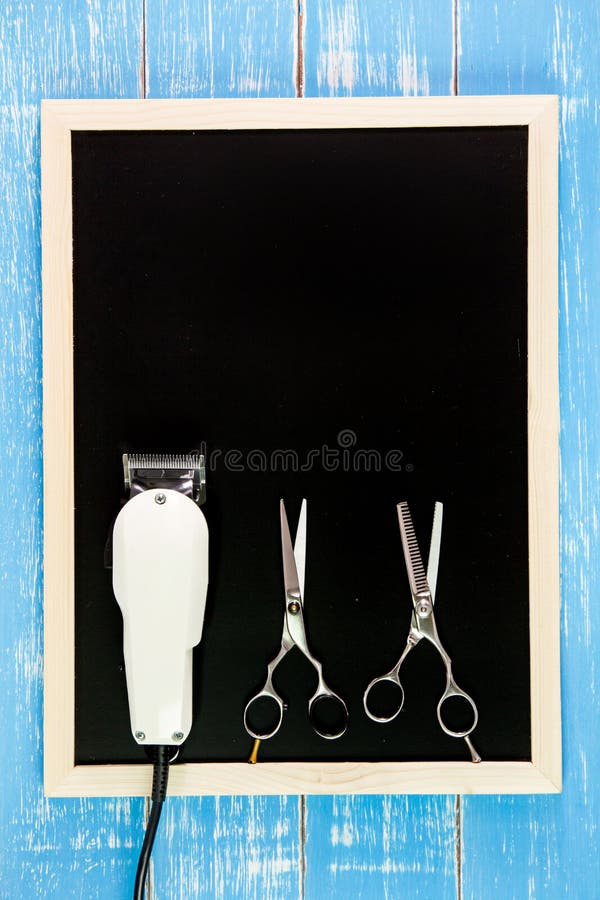 Blank blackboard, Scissors hairdresser and Clipper Barber on woo stock photography