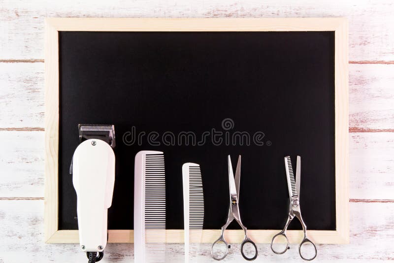 Blank blackboard, Scissors hairdresser and Clipper Barber on woo royalty free stock photos
