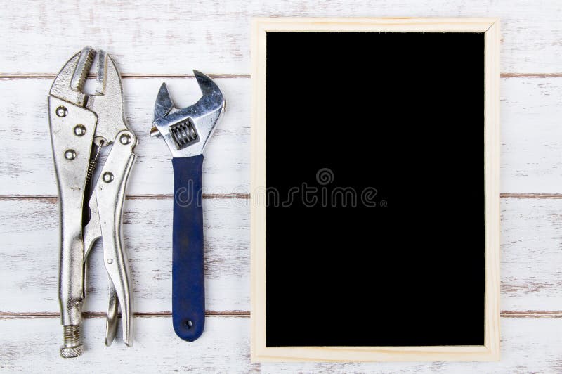 Blank blackboard and Set of repair hand tools. Template mock up f stock photo