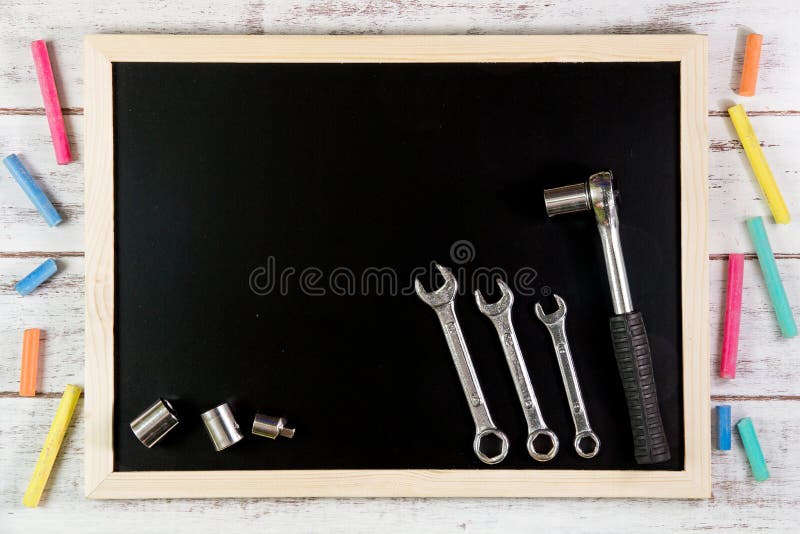 Blank blackboard and Set of wrench on wooden table. Template mock royalty free stock photos