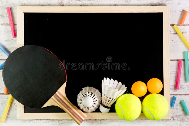 Blank blackboard, Shuttlecock, Ping pong ball and Tennis ball on stock photo