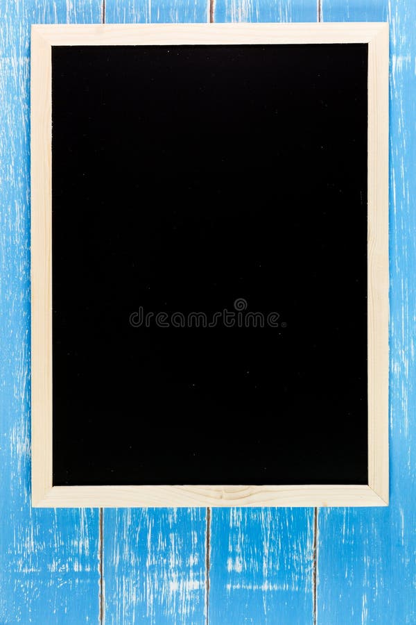 Blank blackboard on wooden table. Template mock up for adding you royalty free stock photography