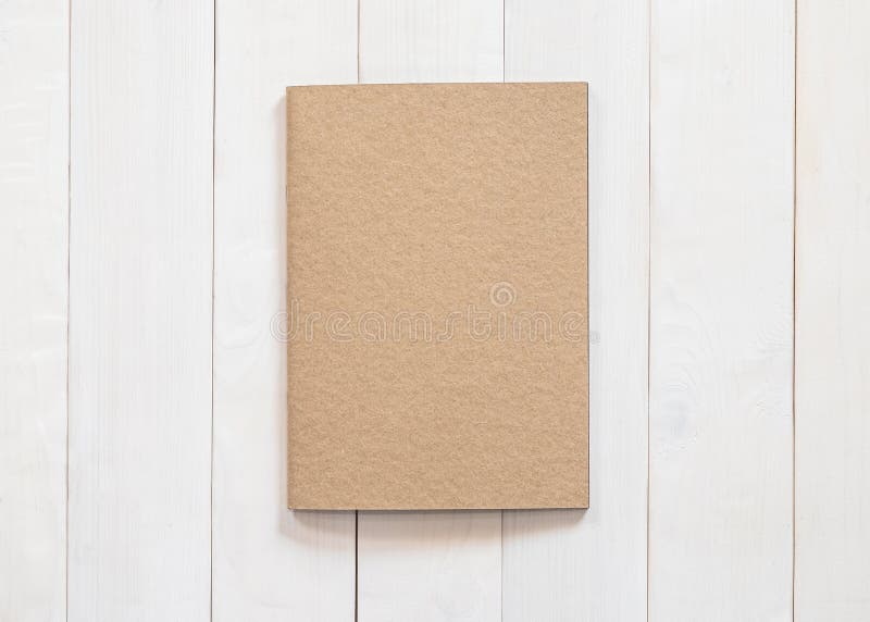 White Book on Brown Wooden Table · Free Stock Photo