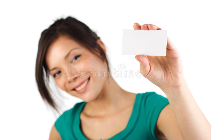 Beautiful young woman with big smile displaying blank business card. Shallow depth of field, focus on card. Isolated on white background. Beautiful young woman with big smile displaying blank business card. Shallow depth of field, focus on card. Isolated on white background.