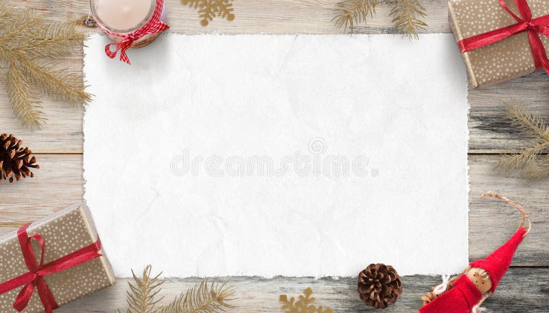 Blank Christmas card mockup for greeting text. Piece of white paper surrounded with gifts and Christmas decorations. stock image Blank Christmas card mockup for greeting text. Piece of white paper surrounded with gifts and Christmas decorations. stock image