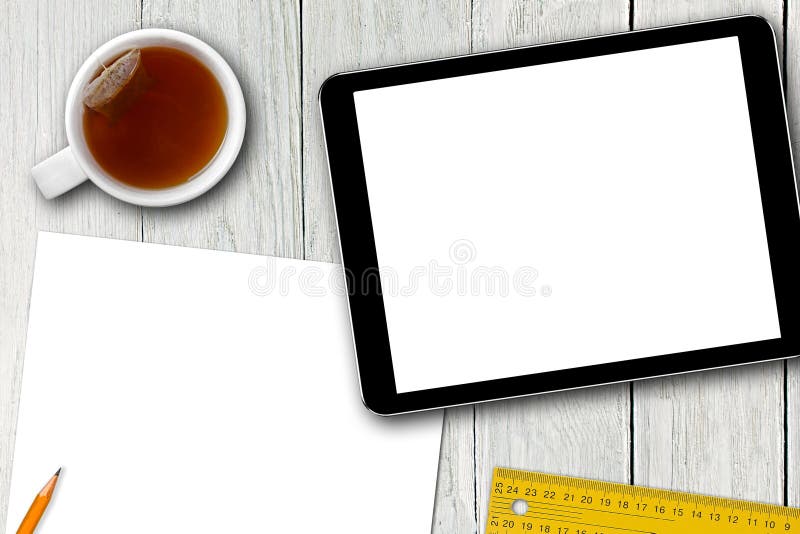 Blank digital tablet, tea cup and paper sheet on wooden table