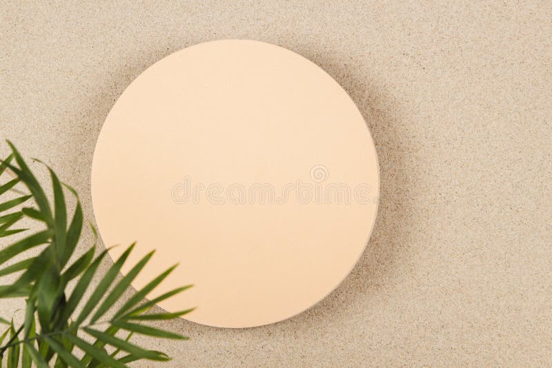 Blank empty beige round platform podium for cosmetics or products presentation on white beach sand background. Top view