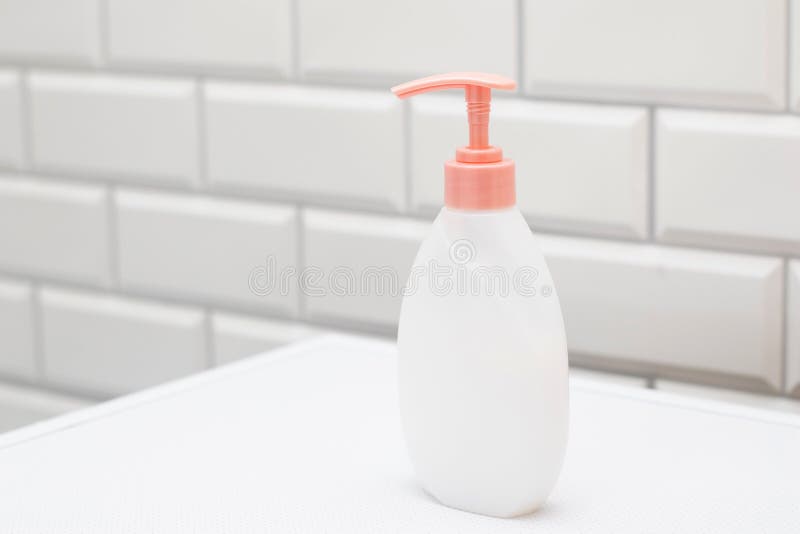 Blank Label Bottles with Liquid Soap Dispenser in Bathroom Stock Photo