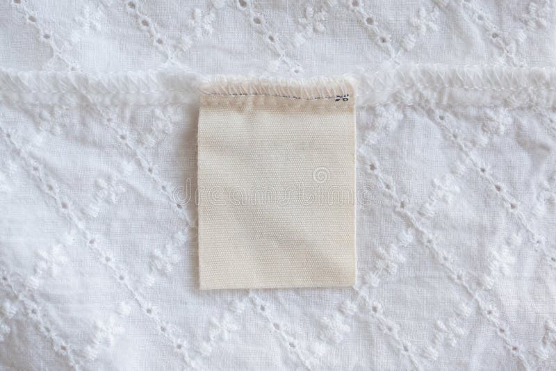 Blank Laundry Care Clothes Label on Fabric Texture Background Stock ...