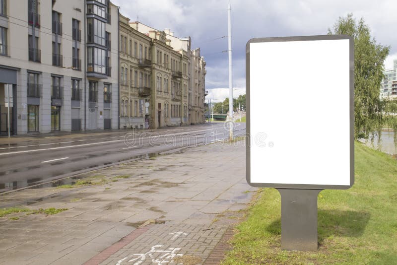 Blank mock up of vertical street poster billboard with copy space for text or image. City background