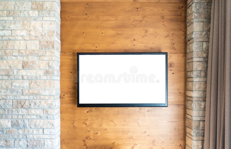 Blank modern flat screen TV at the white brick wall with copy space. Blank modern flat screen TV at the white brick wall with copy space