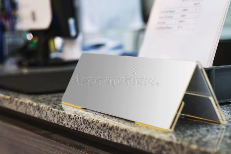 Blank name plate on desk in office