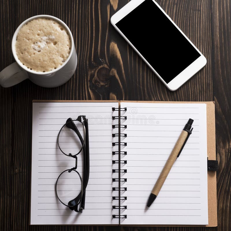Blank Notebook, Coffee and Phone on a Desk