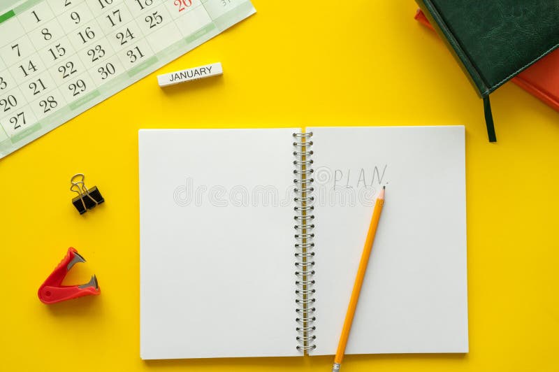 Blank notebook page is on top of desk table. Top view, flat lay. royalty free stock image Blank notebook page is on top of desk table. Top view, flat lay. royalty free stock image