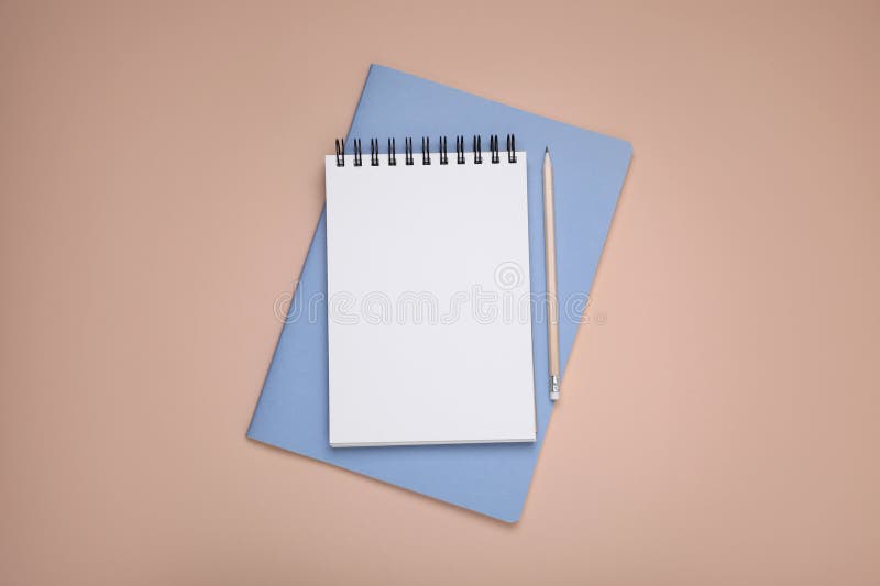 Blank notebook, planner and pencil on beige background, top view. Space for text stock images