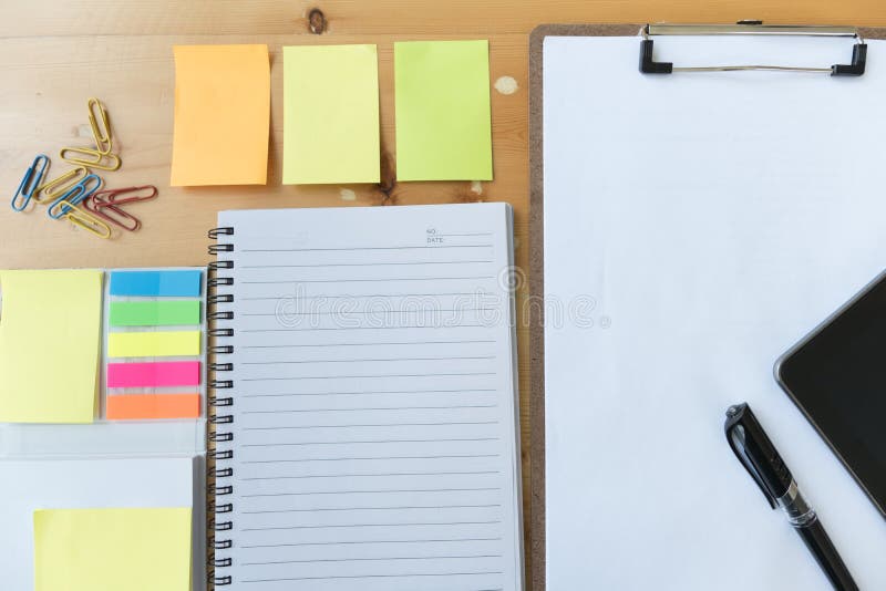 blank paper on clipboard with tablet, pen, notebook, sticky note stock image blank paper on clipboard with tablet, pen, notebook, sticky note stock image