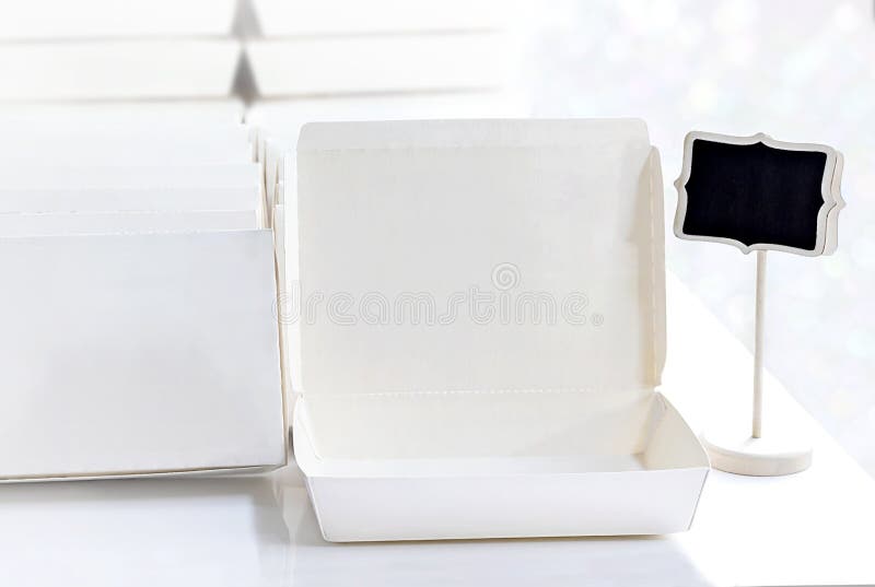 Blank paper package white box for food products and logo branding on the white table background. stock photos Blank paper package white box for food products and logo branding on the white table background. stock photos