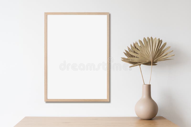 Blank picture frame mockup on white wall vertical template. Artwork in minimal interior design.