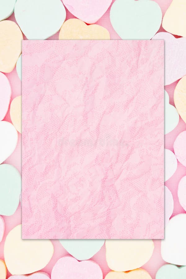 Blank pink greeting card over candy hearts royalty free illustration