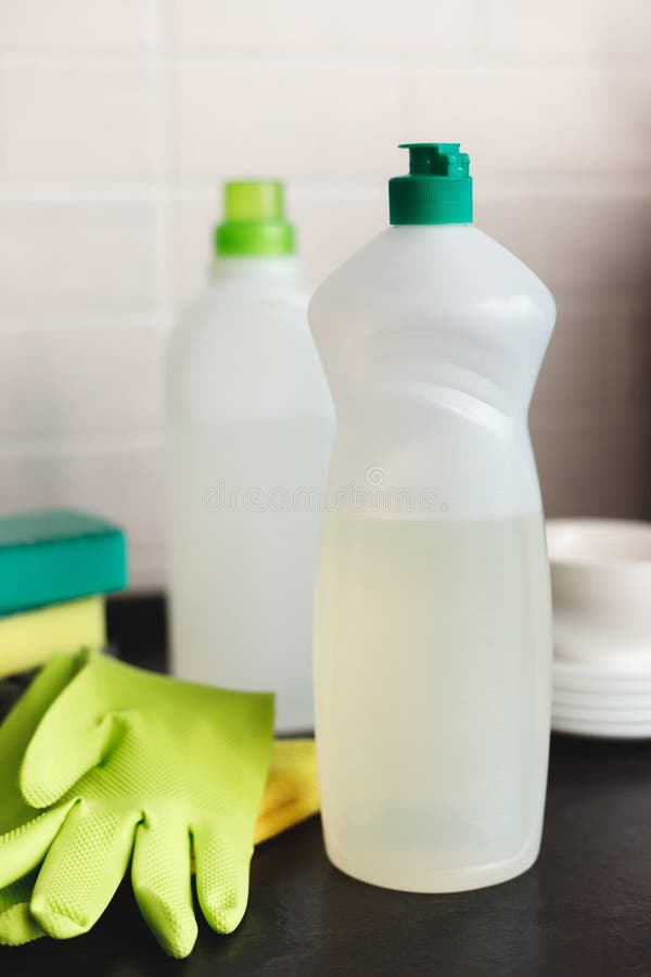 Blank Plastic Bottle with Liquid Dishwashing Detergent on Kitchen Table