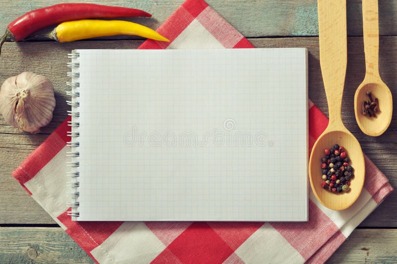 Blank recipe book with kitchen towel on wooden background. Vintage rustic recipe book background stock images, royalty-free photos and pictures