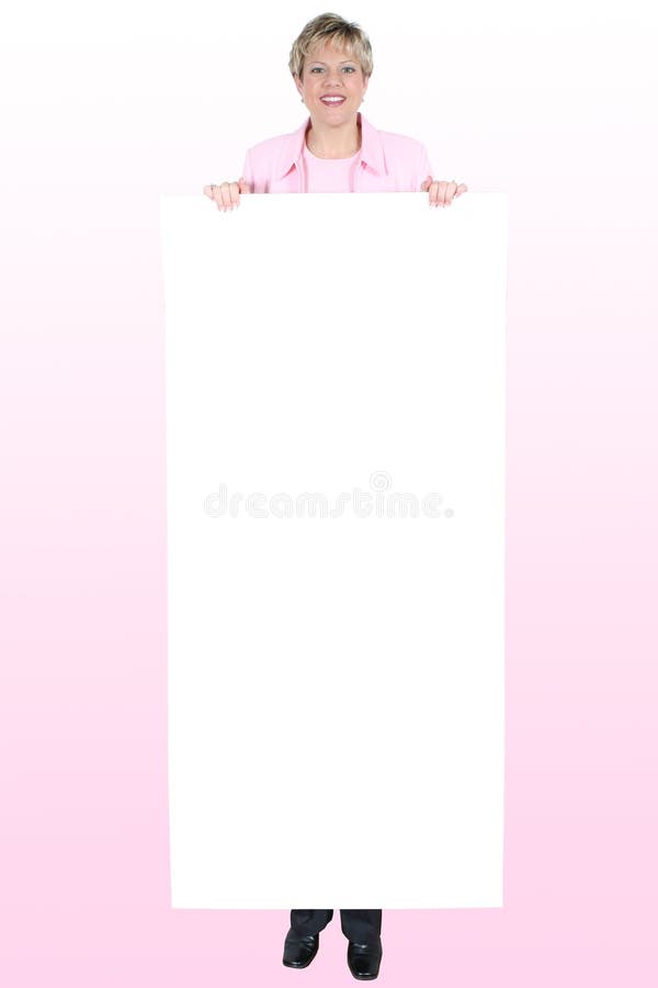 Blank Sign ForText Held By Smiling Woman Over Pink royalty free stock photos Blank Sign ForText Held By Smiling Woman Over Pink royalty free stock photos