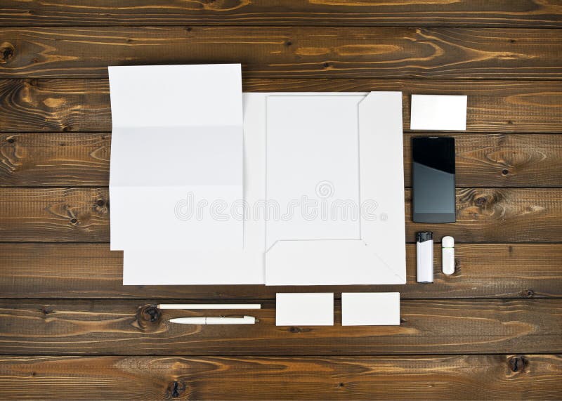 Blank stationery set on wooden background stock images Blank stationery set on wooden background stock images