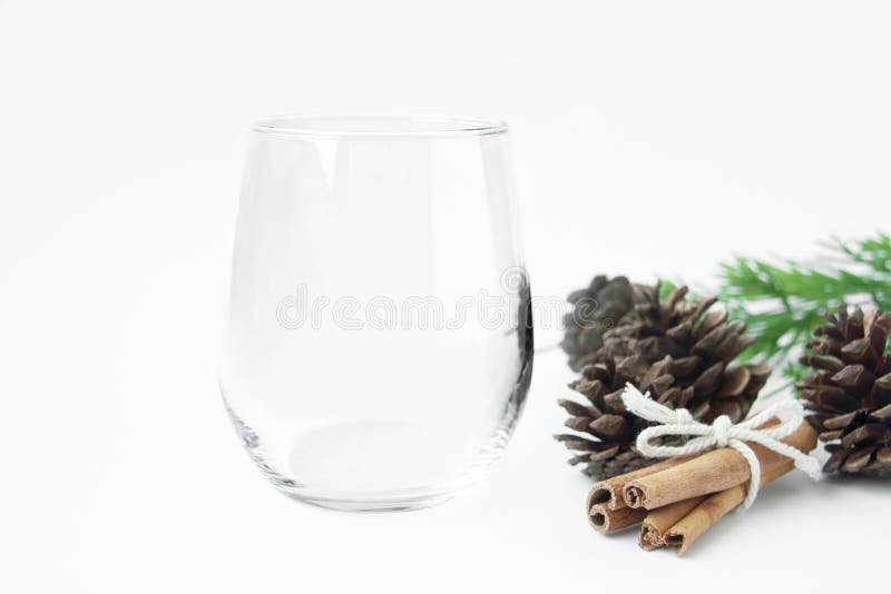 https://thumbs.dreamstime.com/b/blank-stemless-wine-glass-winter-decorations-blank-stemless-wine-glass-winter-decorations-fir-pine-cone-cinnamon-230899872.jpg