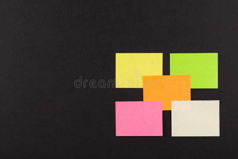 Blank Sticky Note overlapping on black background , five paper sheet background. stock photo Blank Sticky Note overlapping on black background , five paper sheet background. stock photo