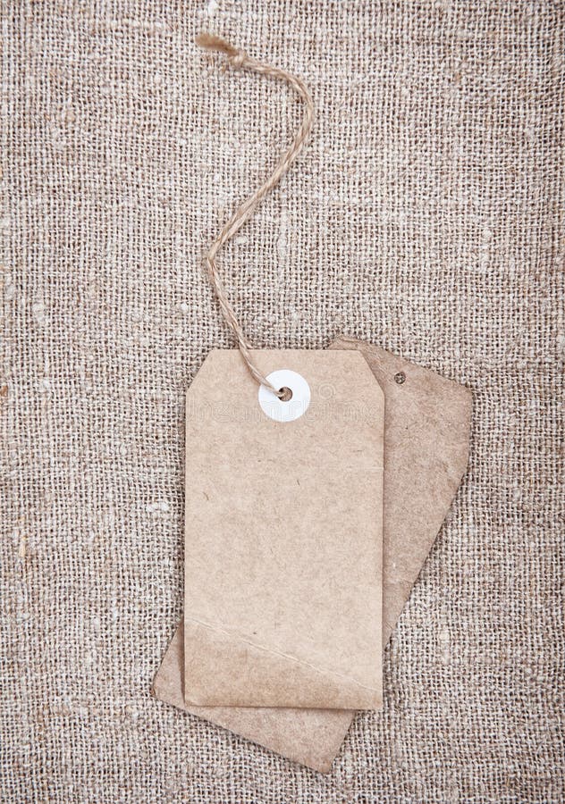 Blank tags retro style on sackcloth stock photo Blank tags retro style on sackcloth stock photo