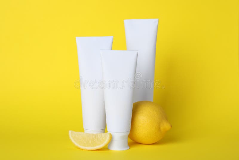 Blank Tubes of Toothpaste and Fresh Lemon on Yellow Background Stock Photo Image of mock