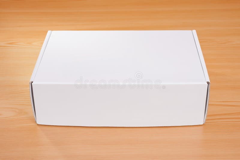 Blank white box on wood stock image. Image of container 76012245