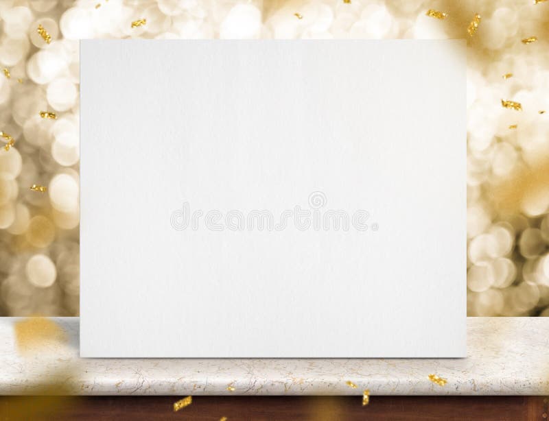 Blank white paper poster on marble table with gold sparkling con stock photo Blank white paper poster on marble table with gold sparkling con stock photo