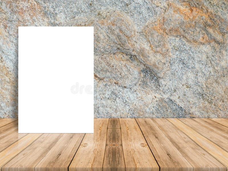 Blank white poster leaning at tropical wood table top with dark