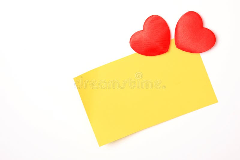 Blank yellow note and hearts